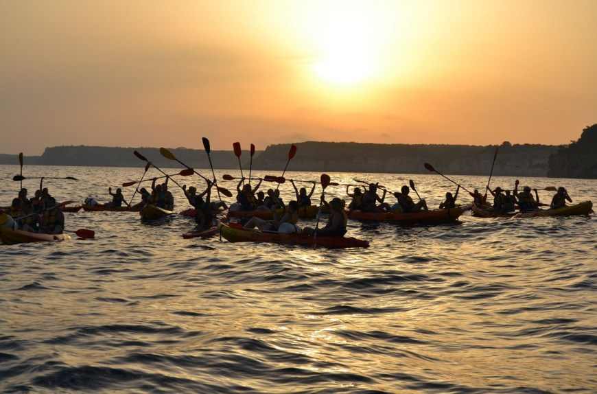 Gaze at the sunset from your kayak